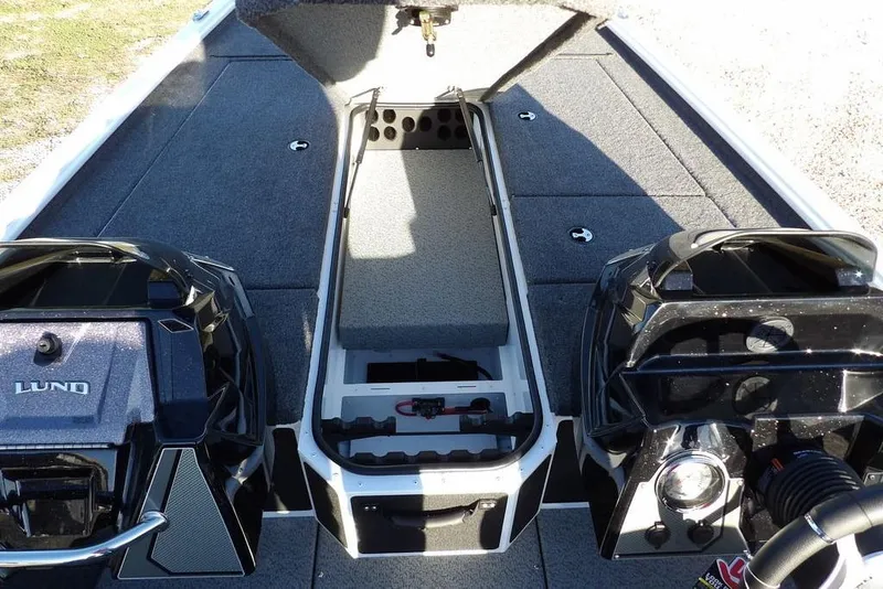 Slide: The Image of 2026 Lund 1975 Renegade boat interior with open storage compartment and dual engines. - 33