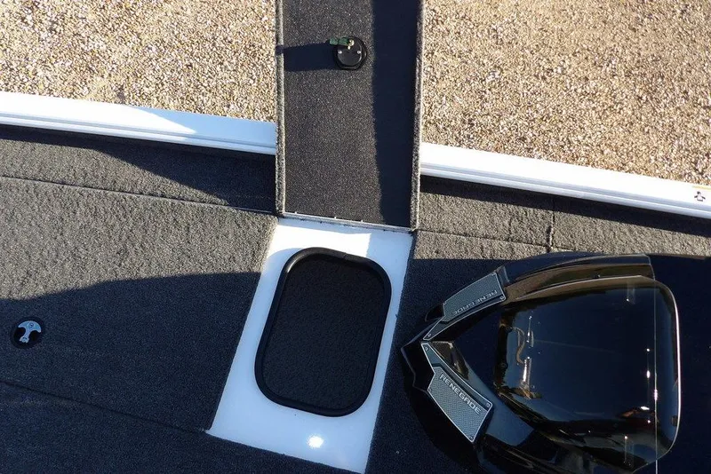 Slide: The Image of Interior view of 2026 Lund 1975 Renegade boat, featuring sleek design and storage compartments. - 38