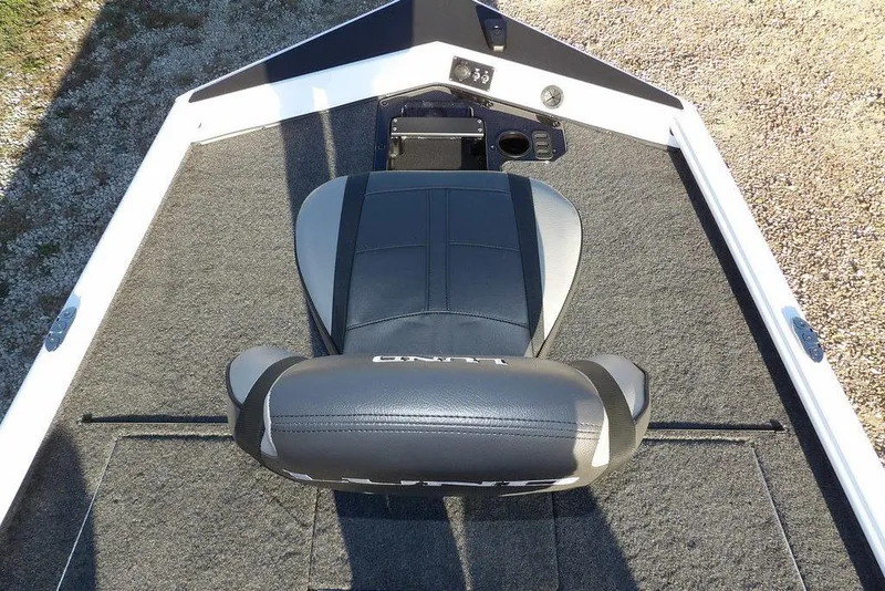 Slide: The Image of 2026 Lund 1975 Renegade boat seat with gray upholstery on deck. - 40