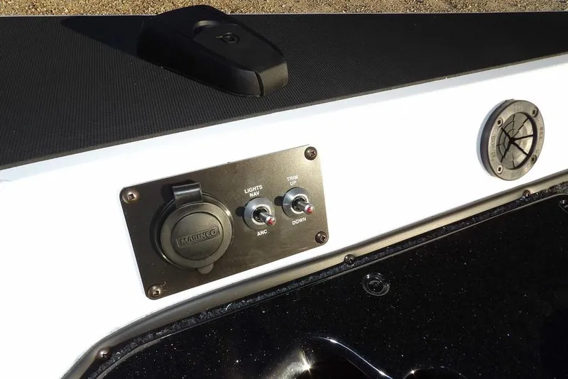 Slide: The Image of Control panel of 2026 Lund 1975 Renegade boat with switches and outlets. - 42