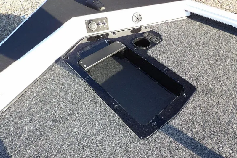 Slide: The Image of 2026 Lund 1975 Renegade boat deck with storage compartment and control panel. - 43