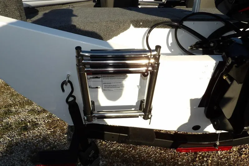 Slide: The Image of Lund 1975 Renegade 2026 boat with a mounted stainless steel ladder. - 50