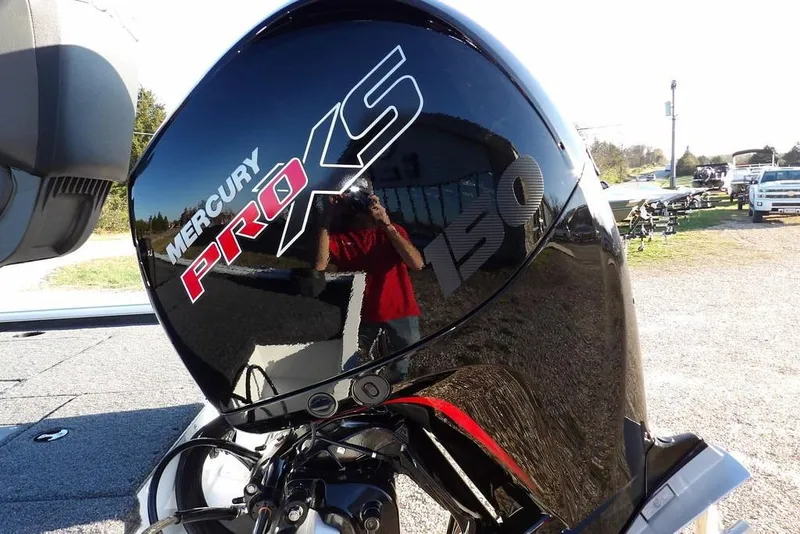 Slide: The Image of Mercury Pro XS 150 engine on 2026 Lund 1975 Renegade boat, outdoor setting. - 54