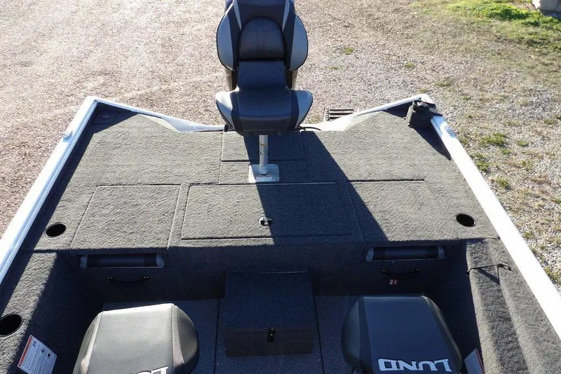 Slide: The Image of 2026 Lund 1975 Renegade boat interior with seating and storage compartments. - 8