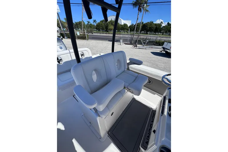 Slide: The Image of 2026 Sea Born LX24 Center Console boat interior with white seating and armrests. - 11