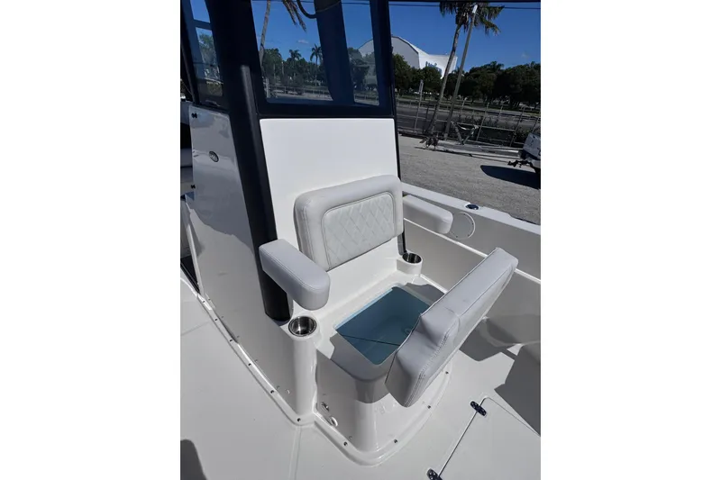 Slide: The Image of 2026 Sea Born LX24 Center Console boat seat with storage compartment, cup holders, and armrests. - 19