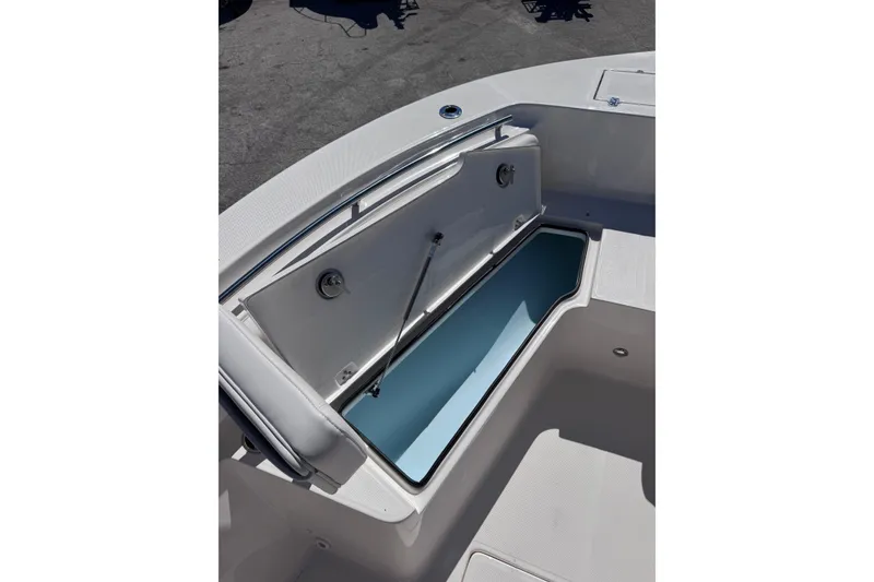 Slide: The Image of 2026 Sea Born LX24 Center Console boat storage compartment open. - 20