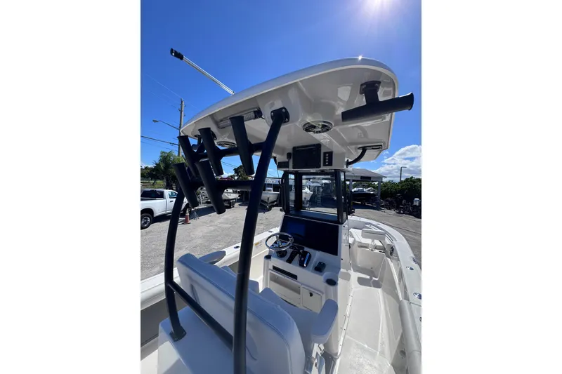 Slide: The Image of 2026 Sea Born LX24 Center Console boat interior with T-top and steering console. - 21