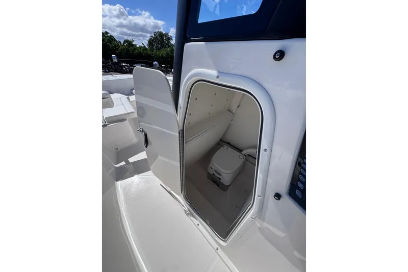 Slide: The Image of 2026 Sea Born LX24 Center Console boat with open storage compartment. - 23