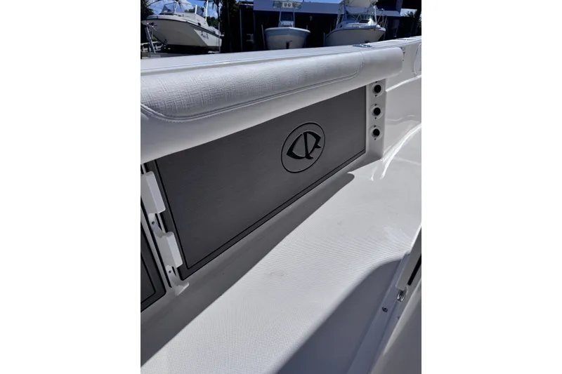 Slide: The Image of 2026 Sea Born LX24 Center Console boat interior detail with storage compartment. - 25