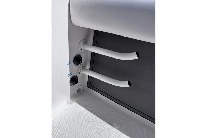 Slide: The Image of 2026 Sea Born LX24 Center Console boat interior with water hose connections. - 26