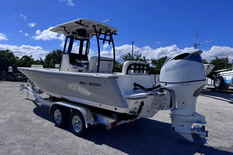 Slide: The Image of 2026 Sea Born LX24 Center Console boat with Suzuki outboard motor on trailer. - 3