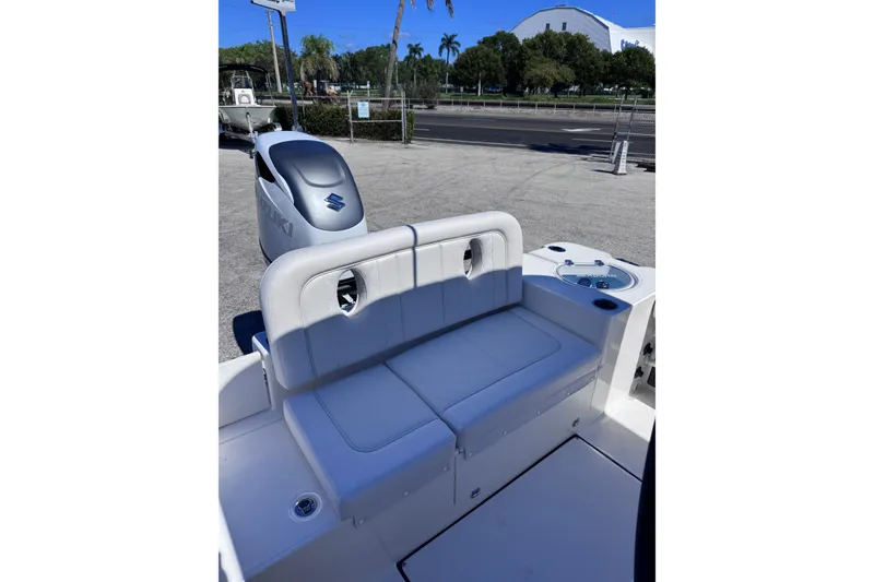 Slide: The Image of 2026 Sea Born LX24 Center Console boat with Suzuki outboard motor, featuring comfortable seating. - 7