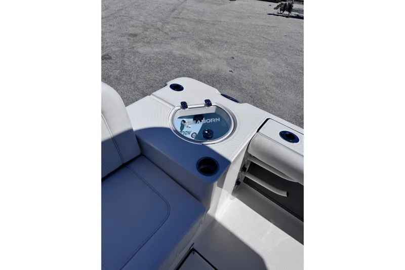 Slide: The Image of 2026 Sea Born LX24 Center Console boat interior with seating and storage compartments. - 8