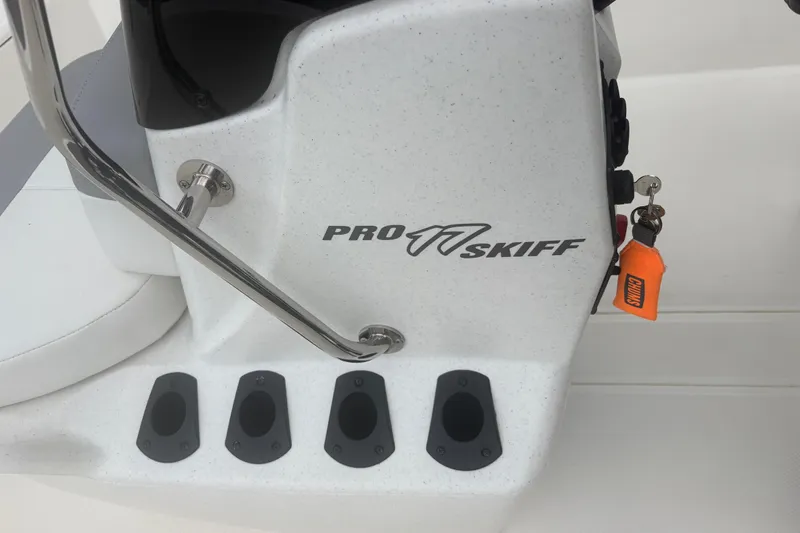 Slide: The Image of 2023 Mako Pro Skiff 17 CC console with rod holders and keychain. - 11