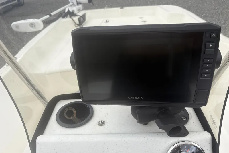 Slide: The Image of 2023 Mako Pro Skiff 17 CC dashboard with Garmin display and controls. - 12