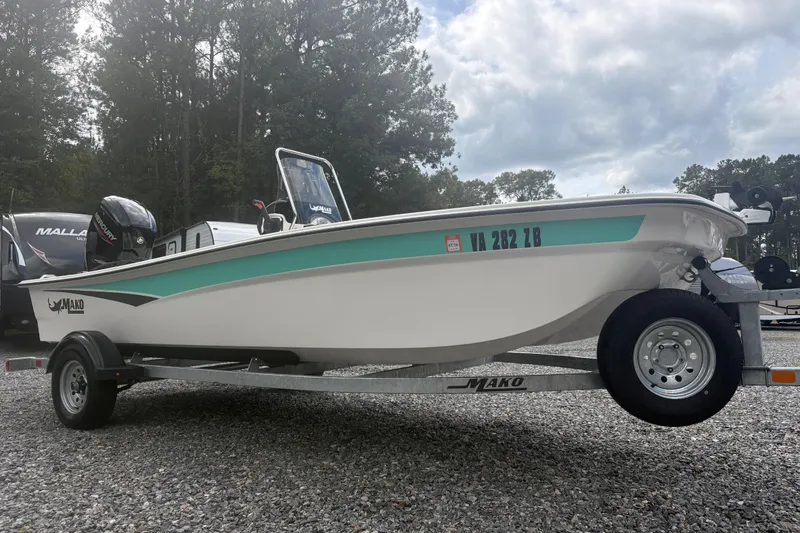 Slide: The Image of 2023 Mako Pro Skiff 17 CC boat on trailer, parked outdoors. - 5