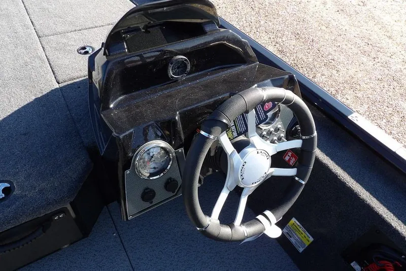 Slide: The Image of Steering console of 2026 Lund 1975 Renegade boat with modern controls. - 16