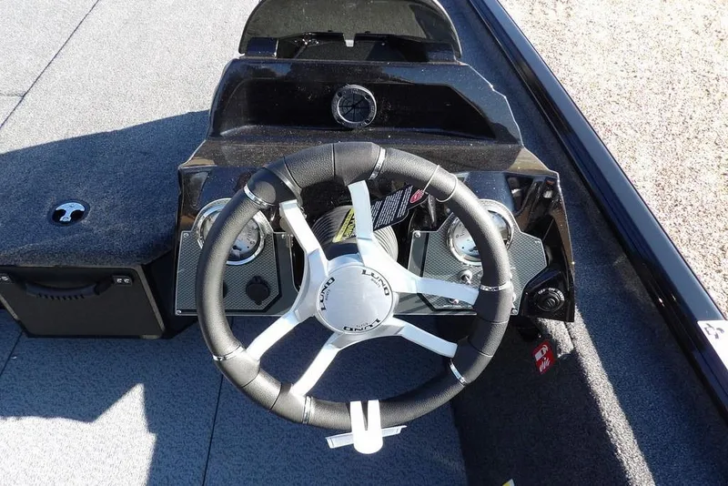 Slide: The Image of Steering console of 2026 Lund 1975 Renegade boat with modern controls and gauges. - 20