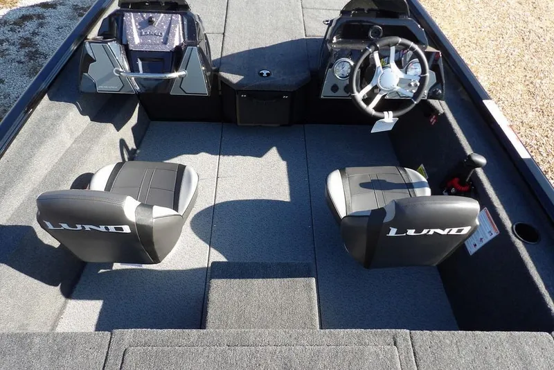 Slide: The Image of Interior of 2026 Lund 1975 Renegade boat with dual seats and steering console. - 22