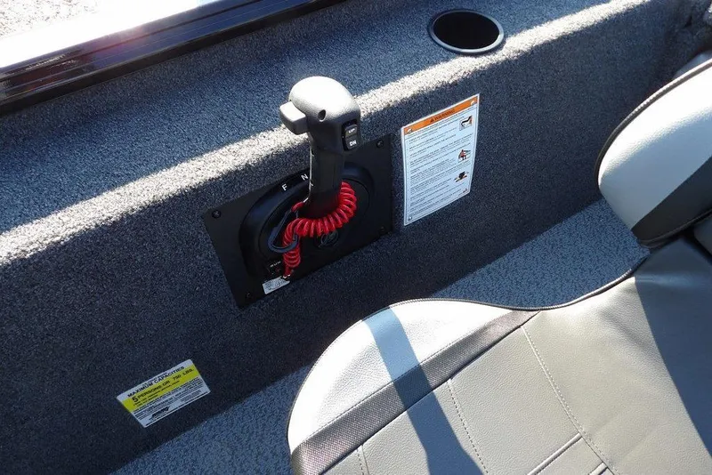 Slide: The Image of Interior of 2026 Lund 1975 Renegade boat with control panel and seat. - 23