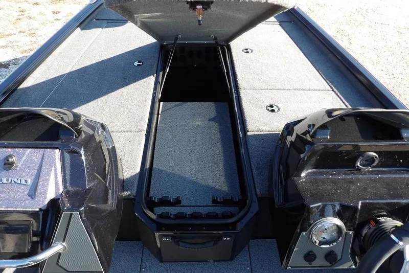 Slide: The Image of 2026 Lund 1975 Renegade boat interior with open storage compartment. - 31