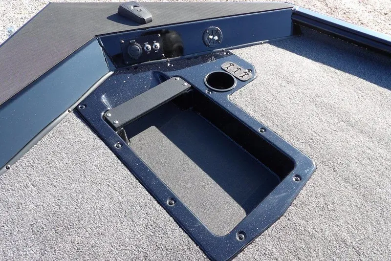 Slide: The Image of Interior view of 2026 Lund 1975 Renegade boat, featuring storage compartment and control panel. - 32