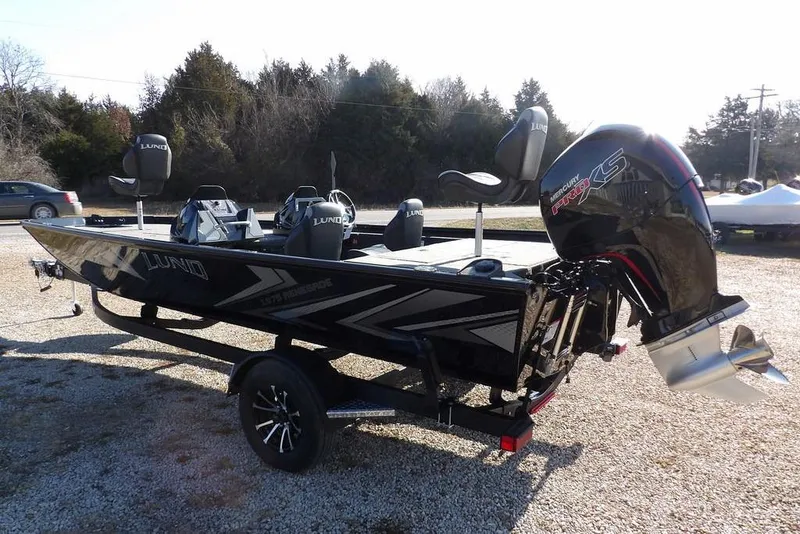 Slide: The Image of 2026 Lund 1975 Renegade boat with Mercury Pro XS engine on trailer. - 4