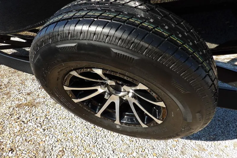 Slide: The Image of Close-up of a 2026 Lund 1975 Renegade tire with sleek alloy wheel design. - 41