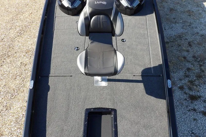 Slide: The Image of 2026 Lund 1975 Renegade boat interior with black and gray seating. - 43