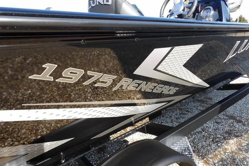 Slide: The Image of Lund 1975 Renegade 2026 boat with sleek black and silver design. - 49