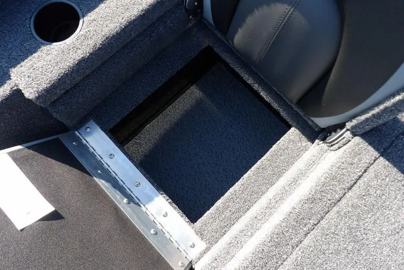 Slide: The Image of Interior of 2026 Lund 1975 Renegade boat showing storage compartment and seating. - 9