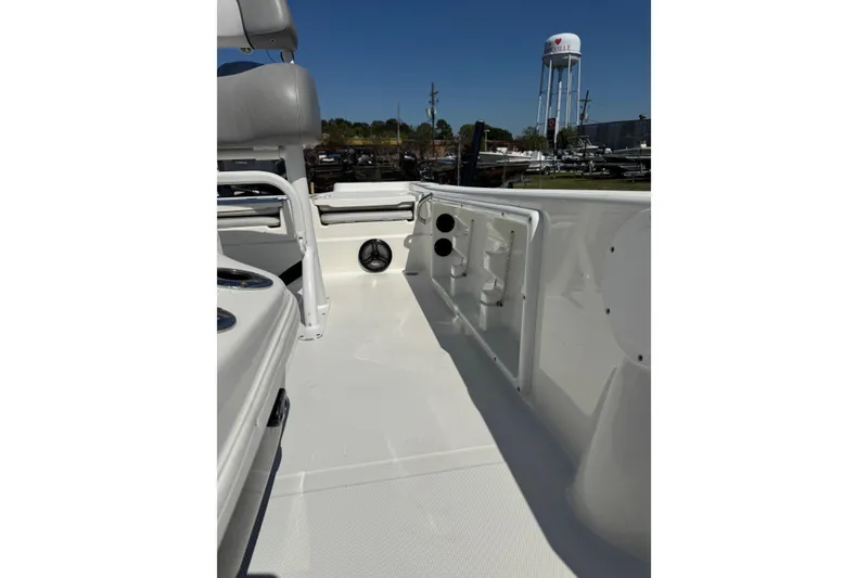 Slide: The Image of 2021 NauticStar 215 XTS Shallow Bay boat interior with seating and storage compartments. - 14