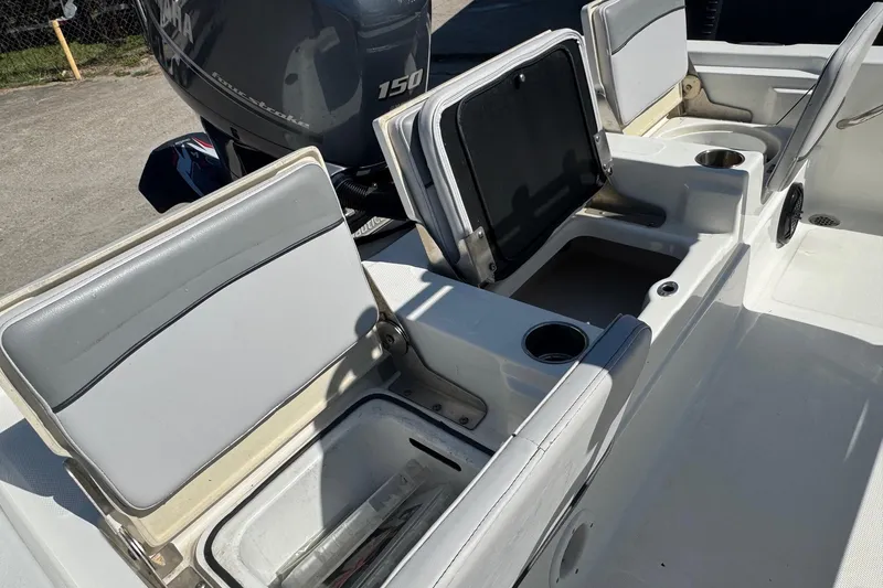 Slide: The Image of 2021 NauticStar 215 XTS Shallow Bay boat interior with open storage compartments. - 21