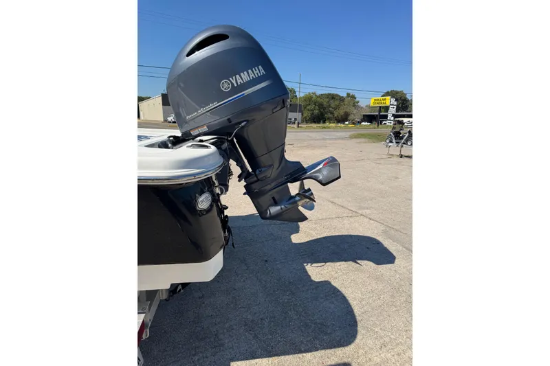 Slide: The Image of 2021 NauticStar 215 XTS Shallow Bay with Yamaha outboard motor in parking lot. - 23
