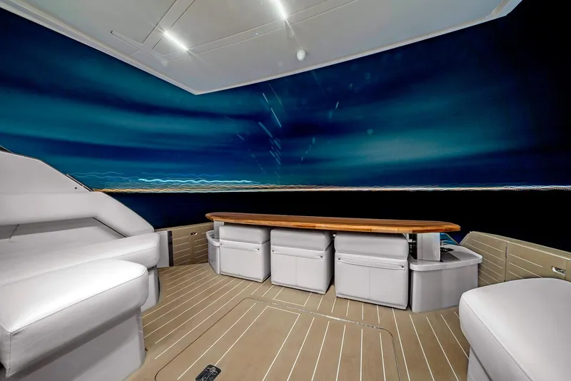 Slide: The Image of 2024 Tiara Yachts EX 60 with TracVision UHD7 satellite domes on deck. - 14