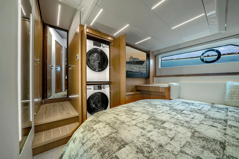 Slide: The Image of 2024 Tiara Yachts EX 60 deck with seating and storage, overlooking water. - 19
