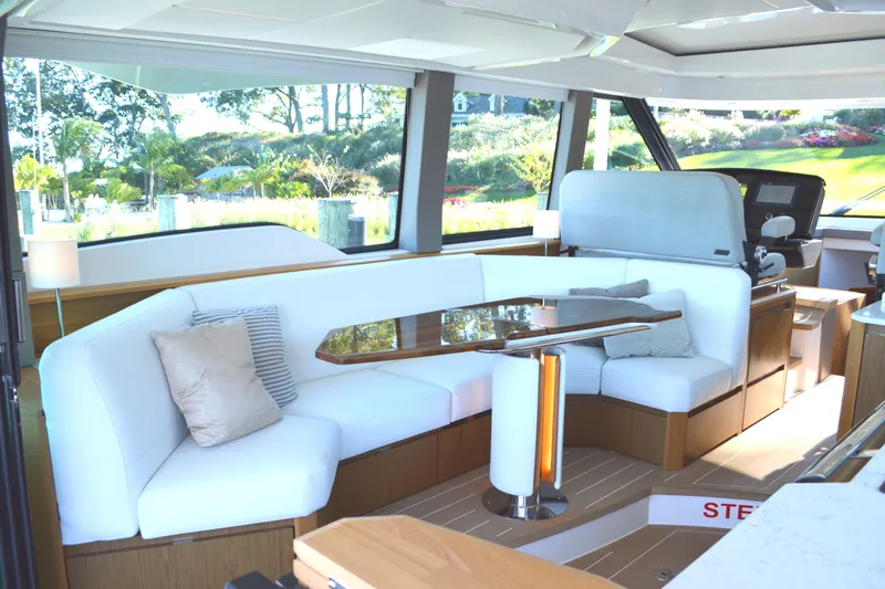 Slide: The Image of Luxurious interior of 2024 Tiara Yachts EX 60 with elegant seating and modern design. - 48