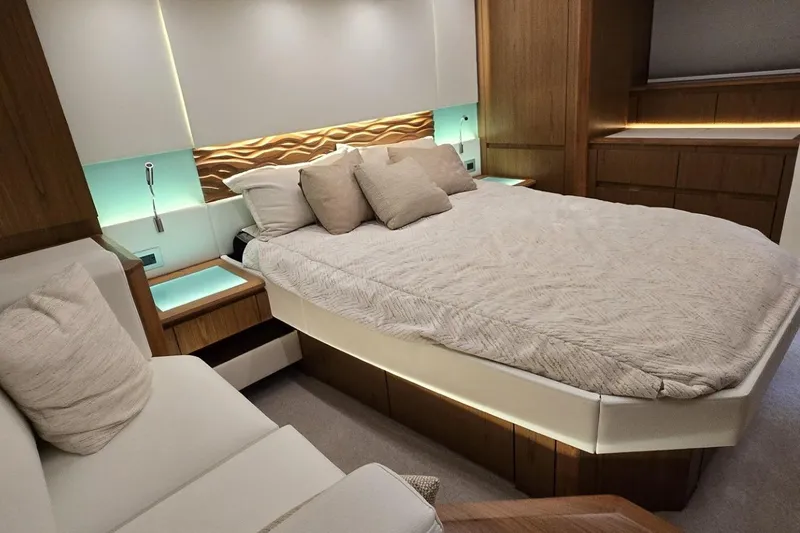 Slide: The Image of Luxurious bedroom interior of 2024 Tiara Yachts EX 60 with modern design and ambient lighting. - 57