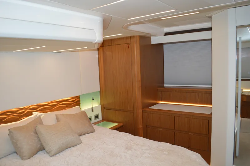 Slide: The Image of Luxurious bedroom interior of 2024 Tiara Yachts EX 60 with modern wood finishes. - 59