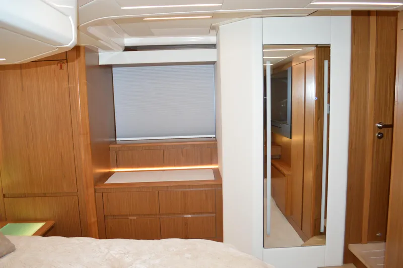 Slide: The Image of Luxurious interior of 2024 Tiara Yachts EX 60, featuring elegant wood finishes and modern design. - 60