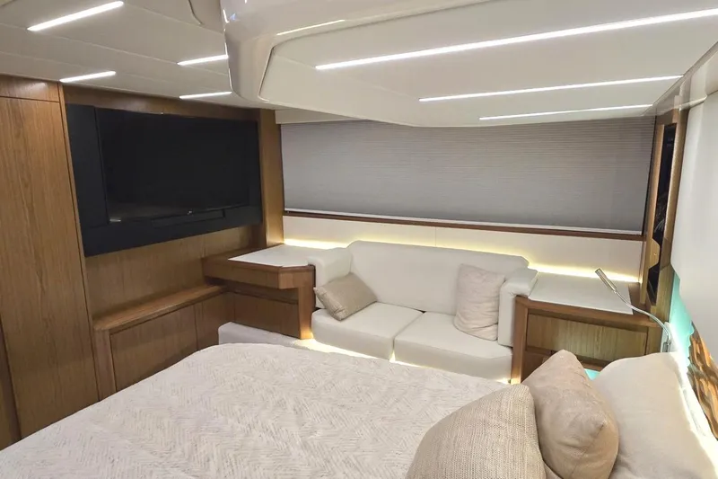 Slide: The Image of Luxurious interior of 2024 Tiara Yachts EX 60 with modern furnishings and ambient lighting. - 61