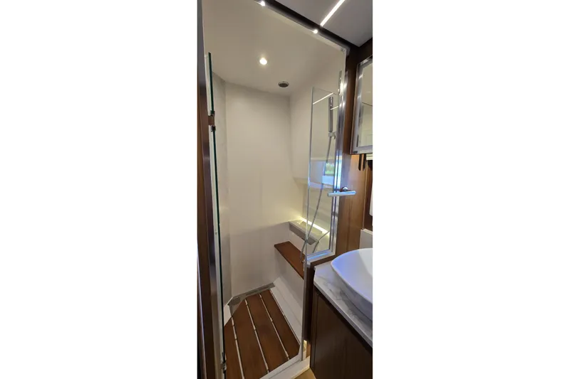 Slide: The Image of Luxurious bathroom interior of 2024 Tiara Yachts EX 60 with modern shower design. - 68