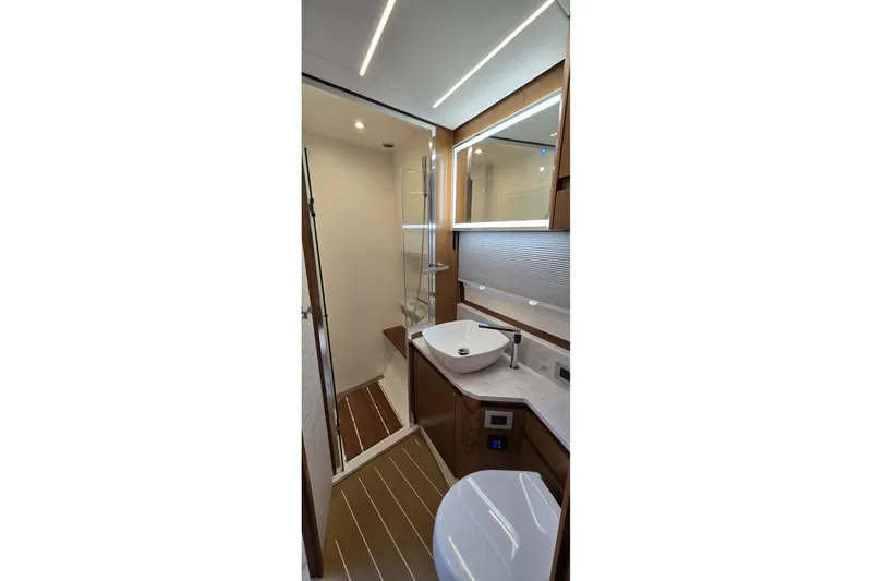 Slide: The Image of Luxurious bathroom in 2024 Tiara Yachts EX 60, featuring modern fixtures and elegant design. - 77