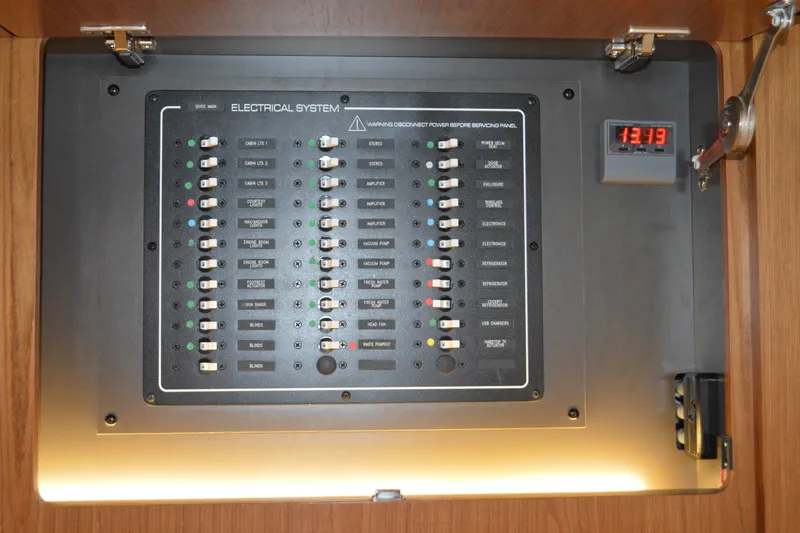 Slide: The Image of Electrical panel of 2024 Tiara Yachts EX 60, showcasing various system controls. - 86