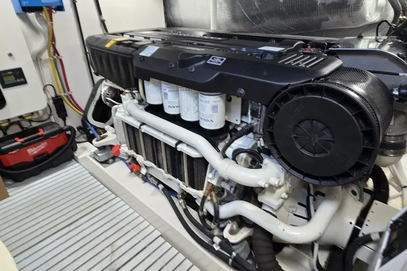 Slide: The Image of Engine room of 2024 Tiara Yachts EX 60, showcasing advanced marine engine components. - 90