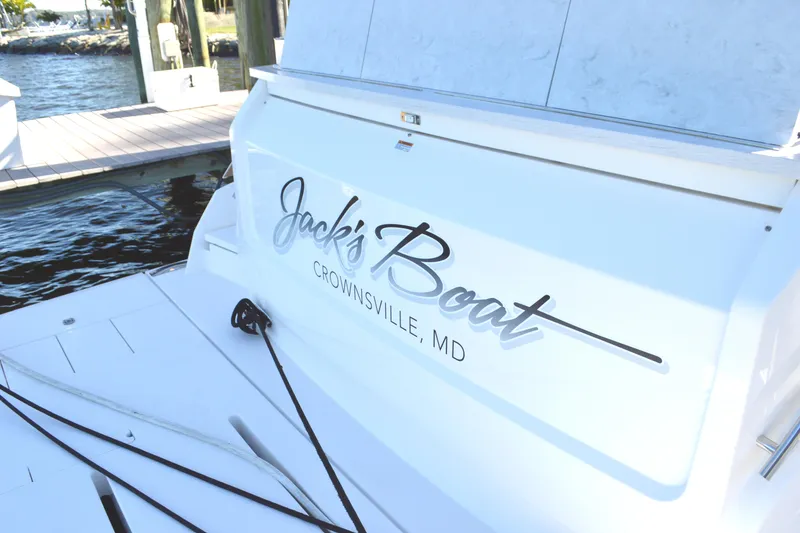 Slide: The Image of 2024 Tiara Yachts EX 60 docked, featuring "Jack's Boat" from Crownsville, MD. - 94