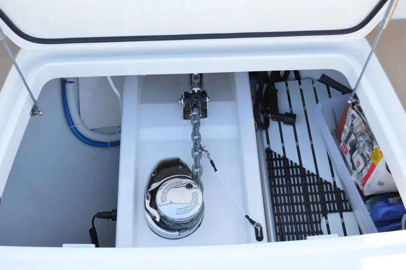 Slide: The Image of Anchor compartment of 2024 Tiara Yachts EX 60 with chain and storage items. - 98