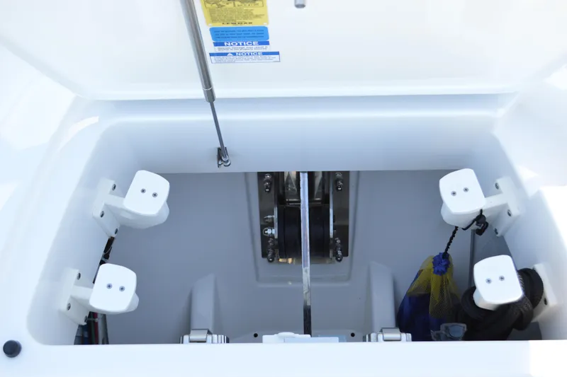 Slide: The Image of Storage compartment of 2024 Tiara Yachts EX 60, featuring organized equipment holders. - 99