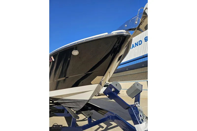 Slide: The Image of 2015 Monterey 288SS Super Sport boat on trailer, sleek black hull, sunny day. - 10